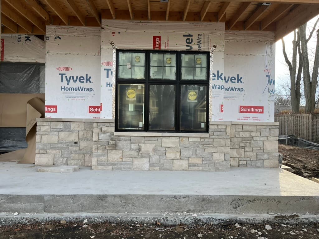 Stone veneer construction